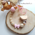 Schnullerkette Schleife mit Namen – rosa